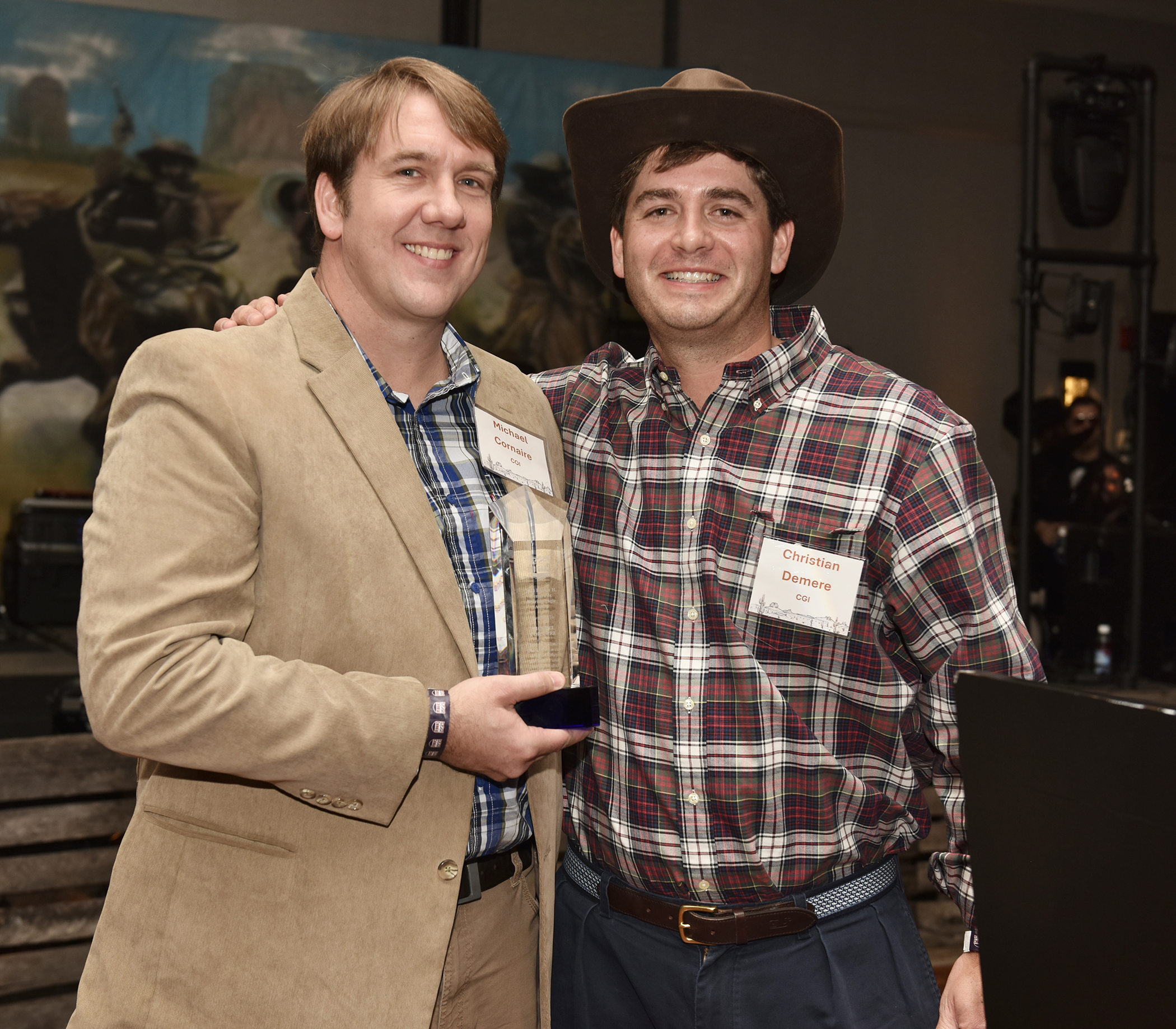 Left to right: Michael Cornaire, Director of Marine Operations, accepts the 2023 Robert H. Demere, Jr. Soaring Eagle Award presented to him by Christian Demere, President and CEO of Colonial Group, Inc. 