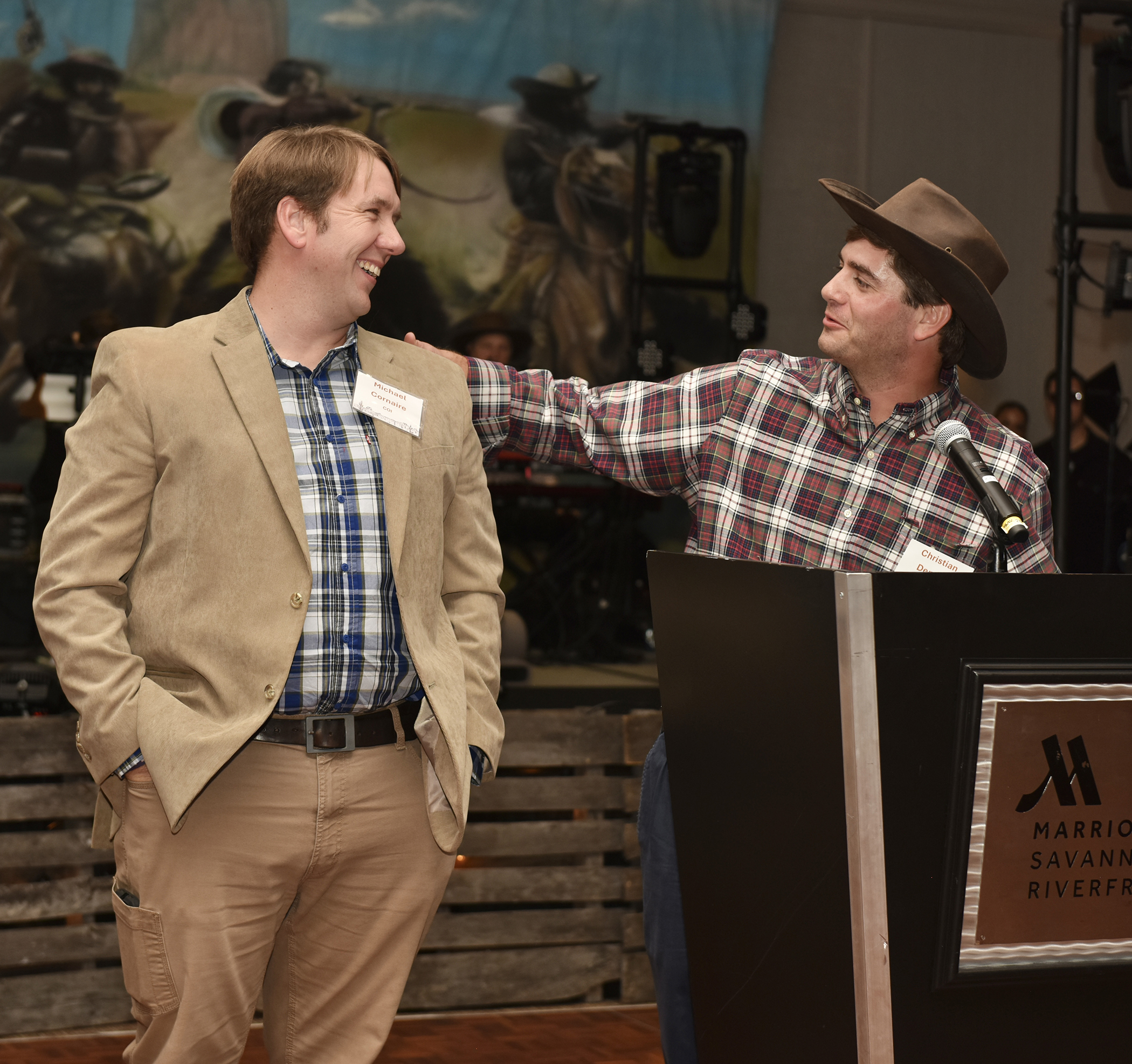 Left to right: Michael Cornaire, Director of Marine Operations, listens as Christian Demere, President and CEO of Colonial Group, Inc., speaks about why Cornaire was deserving of the 2023 Robert H. Demere, Jr. Soaring Eagle Award